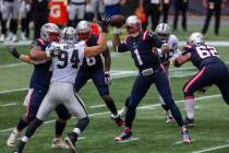 Las Vegas Raiders defensive end Carl Nassib (94) reaches out to get a hand on a pass thrown by ...