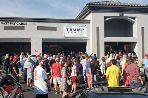 A crowd waits outside the Summerlin office of President Trump’s re-election campaign Saturday ...