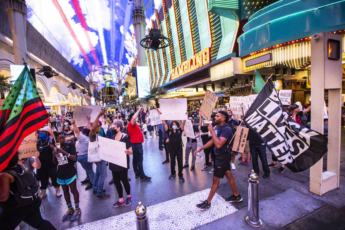 People march during a protest against U.S. Immigration and Customs Enforcement (ICE) in downtow ...
