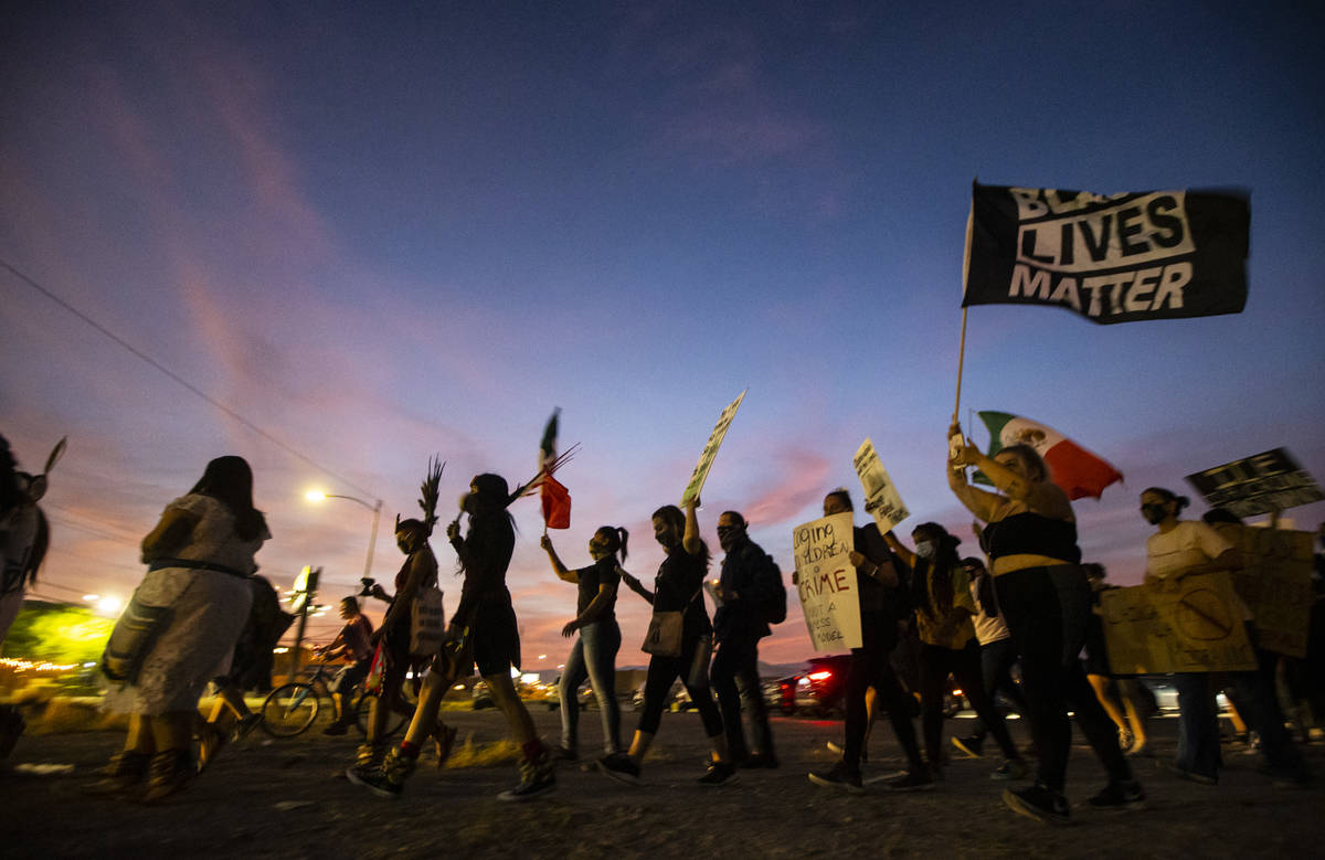 People march during a protest against U.S. Immigration and Customs Enforcement (ICE) in downtow ...