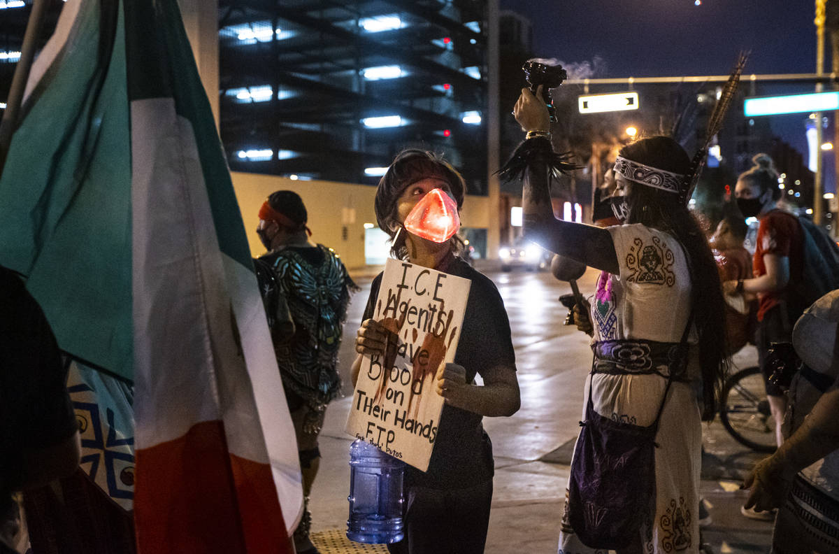 People march during a protest against U.S. Immigration and Customs Enforcement (ICE) in downtow ...