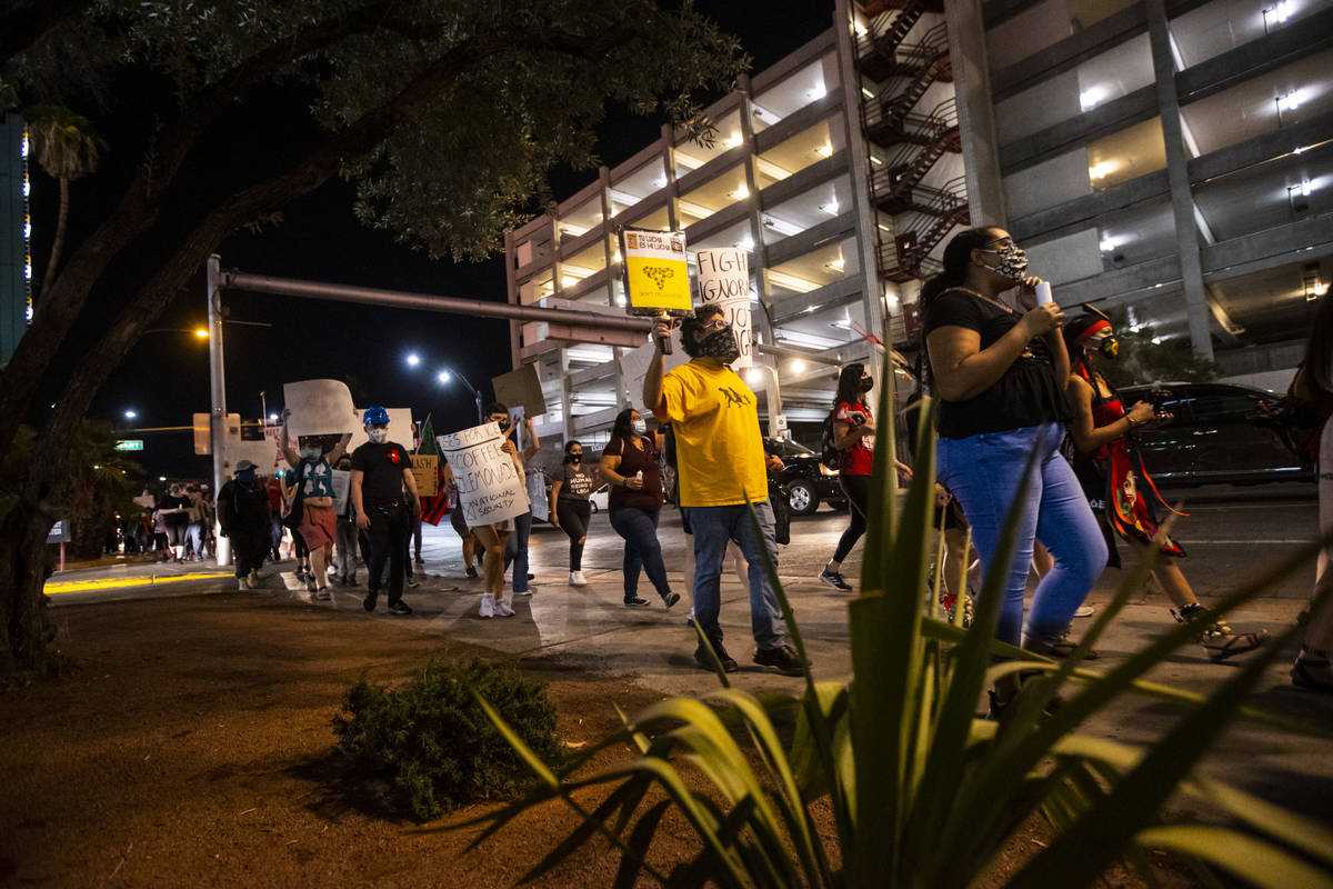 People march during a protest against U.S. Immigration and Customs Enforcement (ICE) in downtow ...