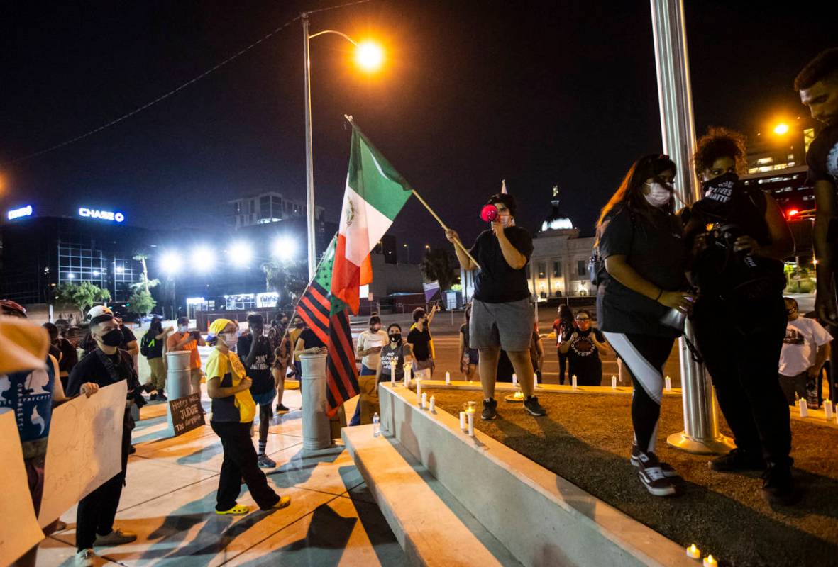 People march during a protest against U.S. Immigration and Customs Enforcement (ICE) in downtow ...