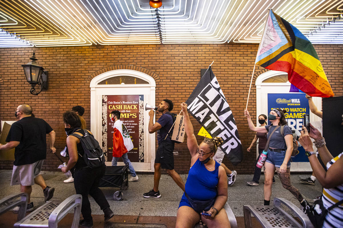 People march during a protest against U.S. Immigration and Customs Enforcement (ICE) in downtow ...