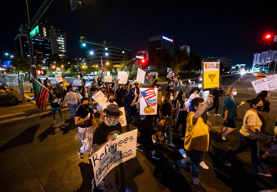 People march during a protest against U.S. Immigration and Customs Enforcement (ICE) in downtow ...