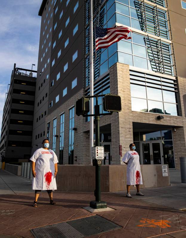 Fawn Douglas, right, leads a protest against U.S. Immigration and Customs Enforcement (ICE) to ...
