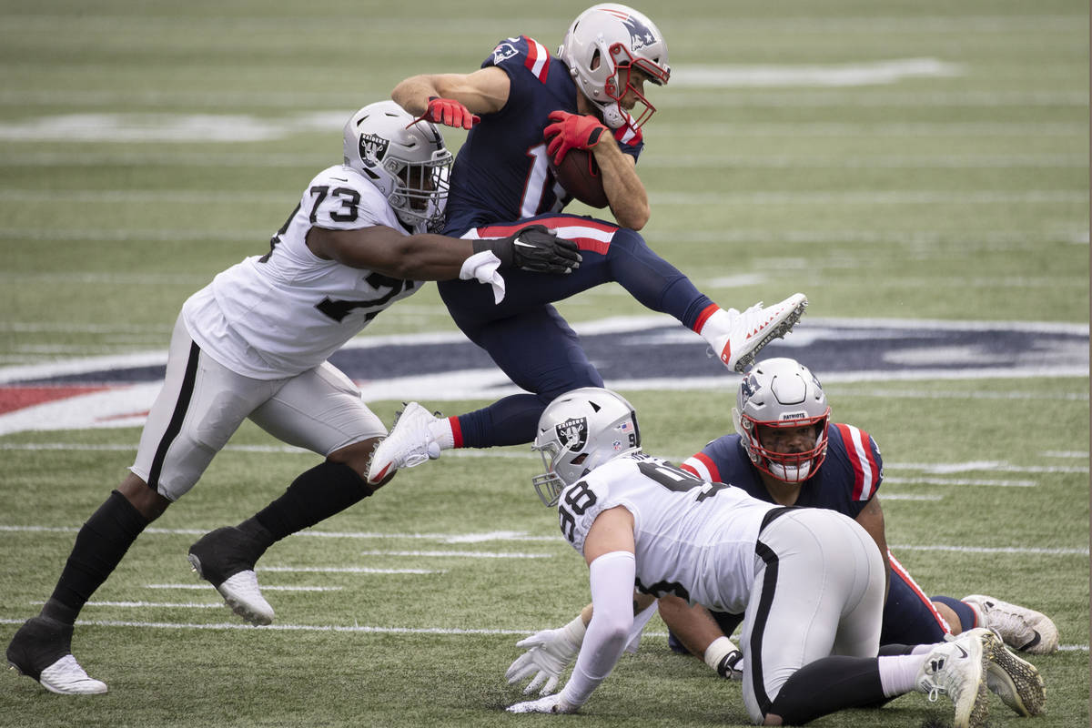 Las Vegas Raiders defensive tackle Maurice Hurst (73) tackles New England Patriots wide receiv ...