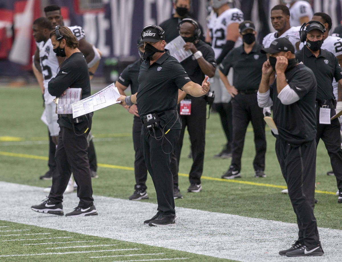 Las Vegas Raiders head coach Jon Gruden, center, reacts as referees review a fumble recovery an ...