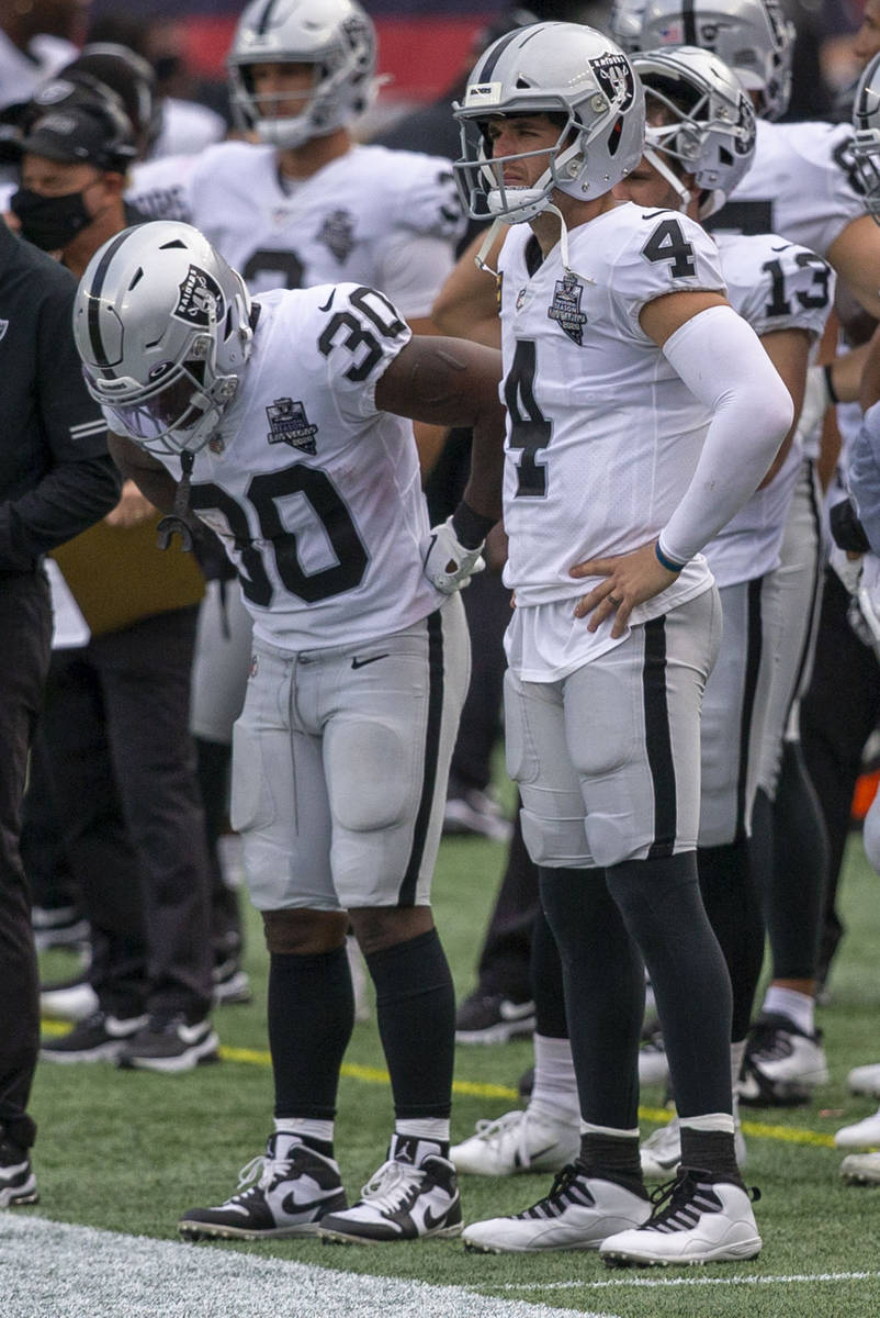 Las Vegas Raiders running back Jalen Richard (30) and Las Vegas Raiders quarterback Derek Carr ...