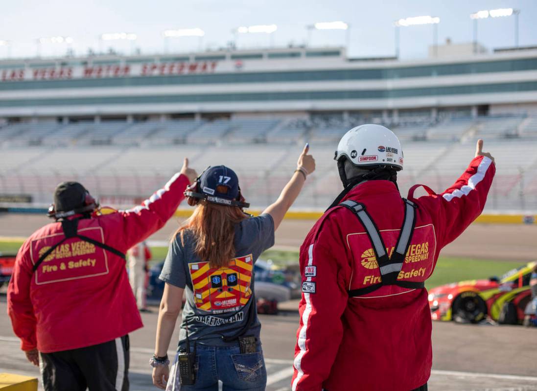 The pit fire safety team gives the okay for the race to begin before a NASCAR Cup Series a ...