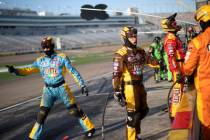 The pit crew for Kyle Busch (18) sends off his car during a NASCAR Cup Series auto race on ...
