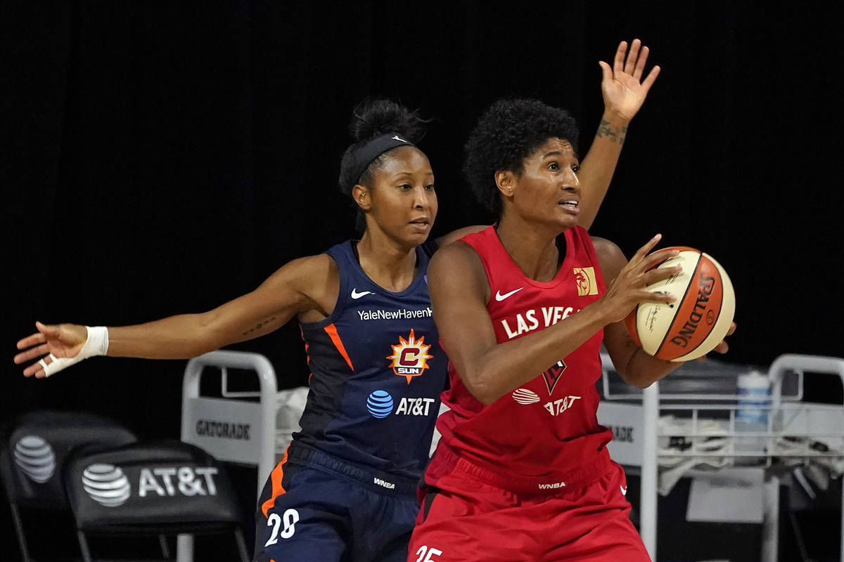 Las Vegas Aces forward Angel McCoughtry (35) goes up against Connecticut Sun guard Briann Janua ...