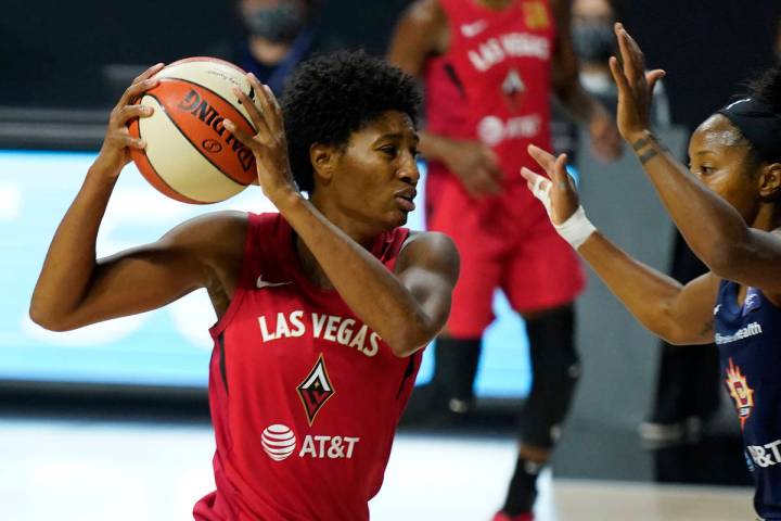 Las Vegas Aces forward Angel McCoughtry (35) drives against Connecticut Sun guard Briann Januar ...