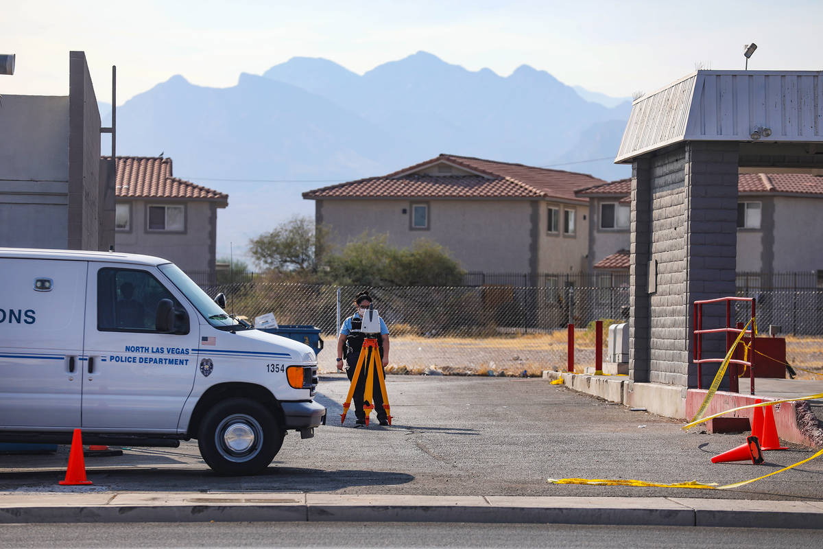 A North Las Vegas police officer works the scene of a homicide where a man was fatally shot Sun ...