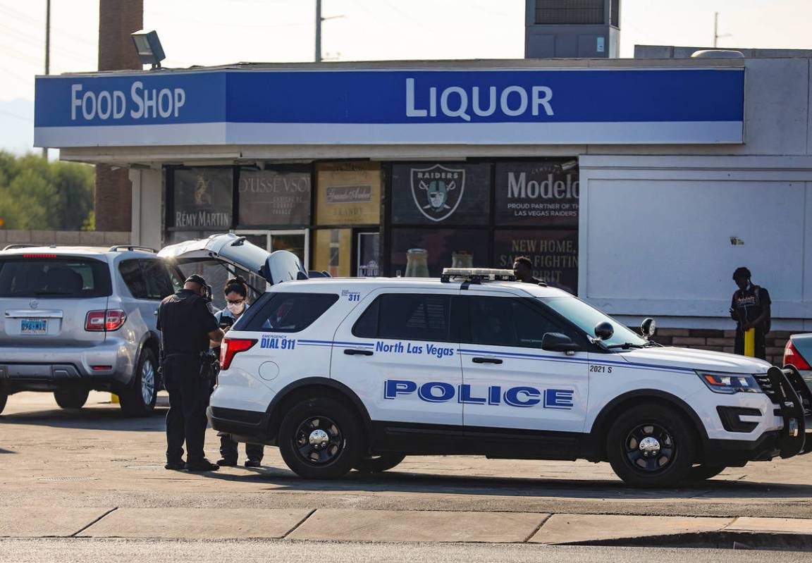 North Las Vegas police officers work the scene of a homicide where a man was fatally shot Sunda ...