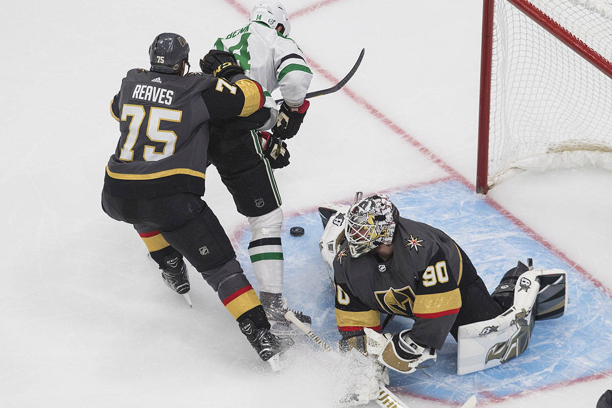 Dallas Stars' Jamie Benn (14) is stopped by Vegas Golden Knights' goalie Robin Lehner (90) as G ...