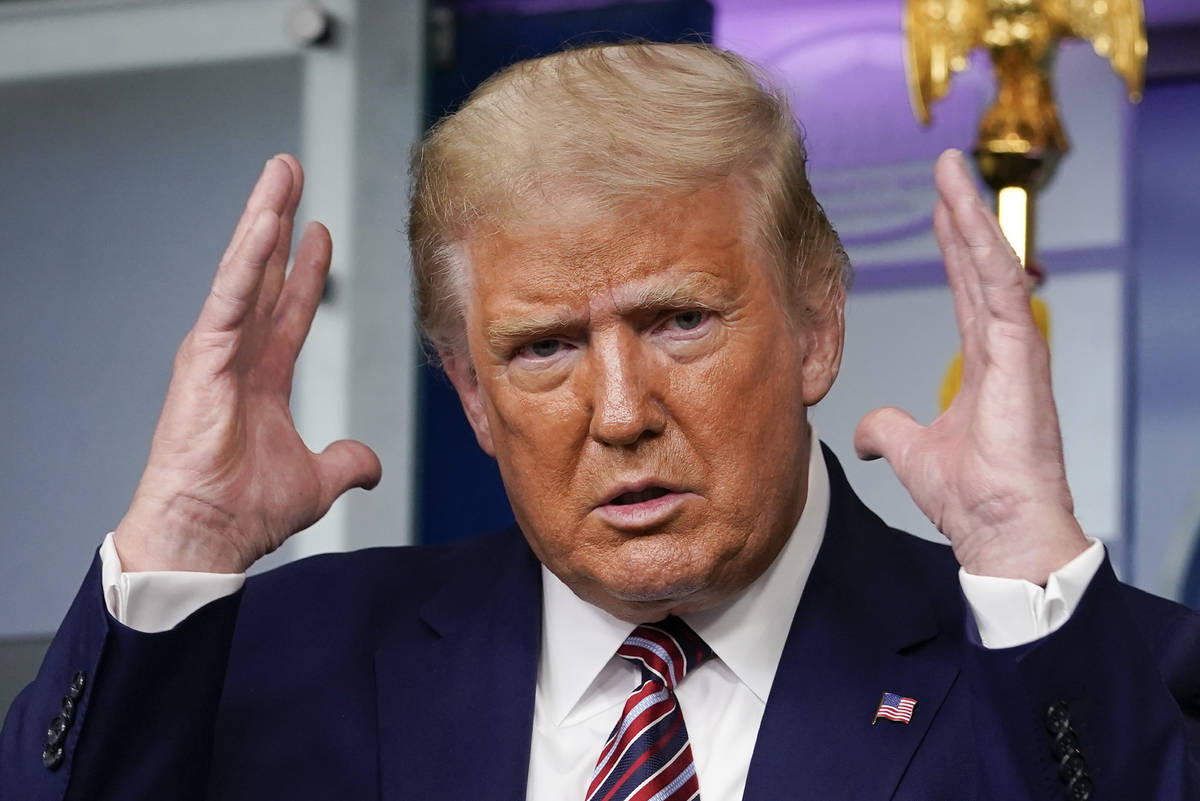 President Donald Trump gestures while speaking during a news conference at the White House, Sun ...