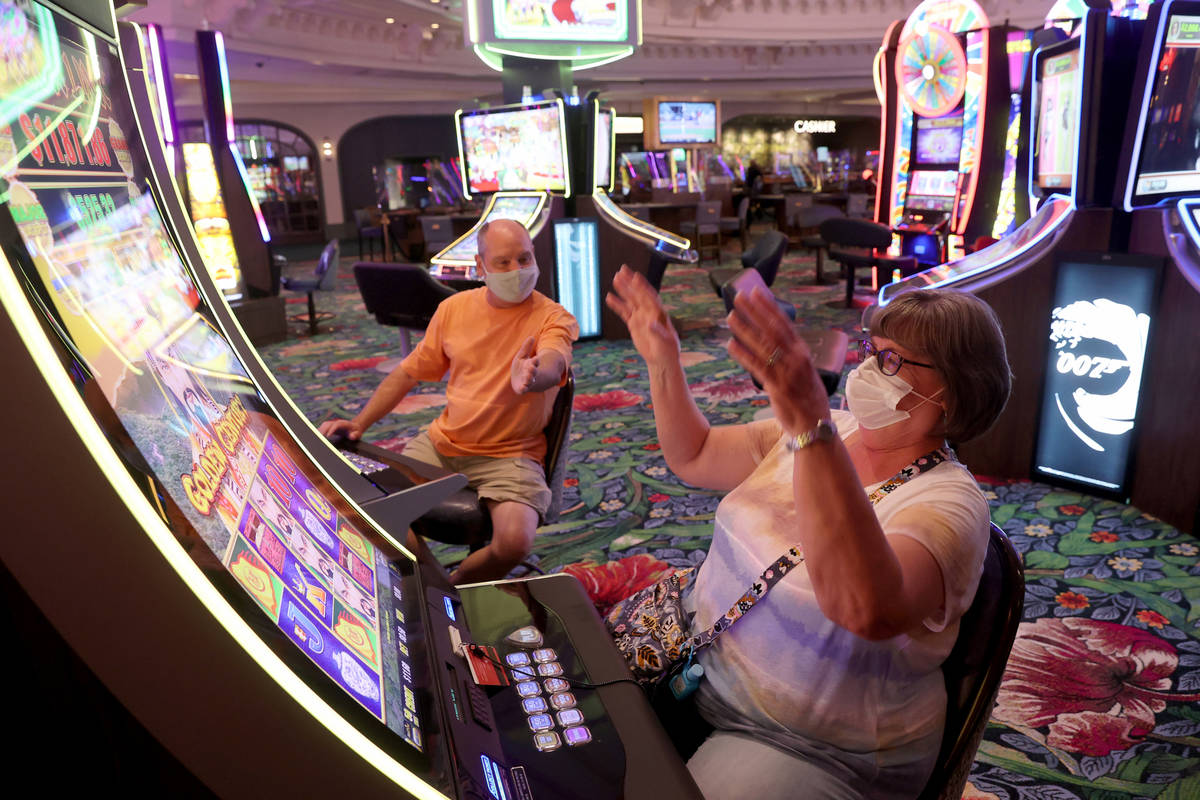 Matt and Donna Daniels of Midlothian, Ill. celebrate a winning play as Park MGM reopens after t ...