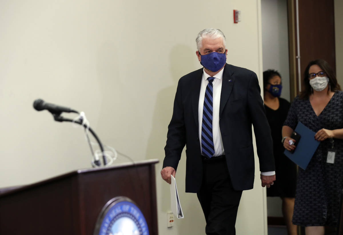 Nevada Gov. Steve Sisolak arrives for a news conference at the Grant Sawyer State Building in L ...