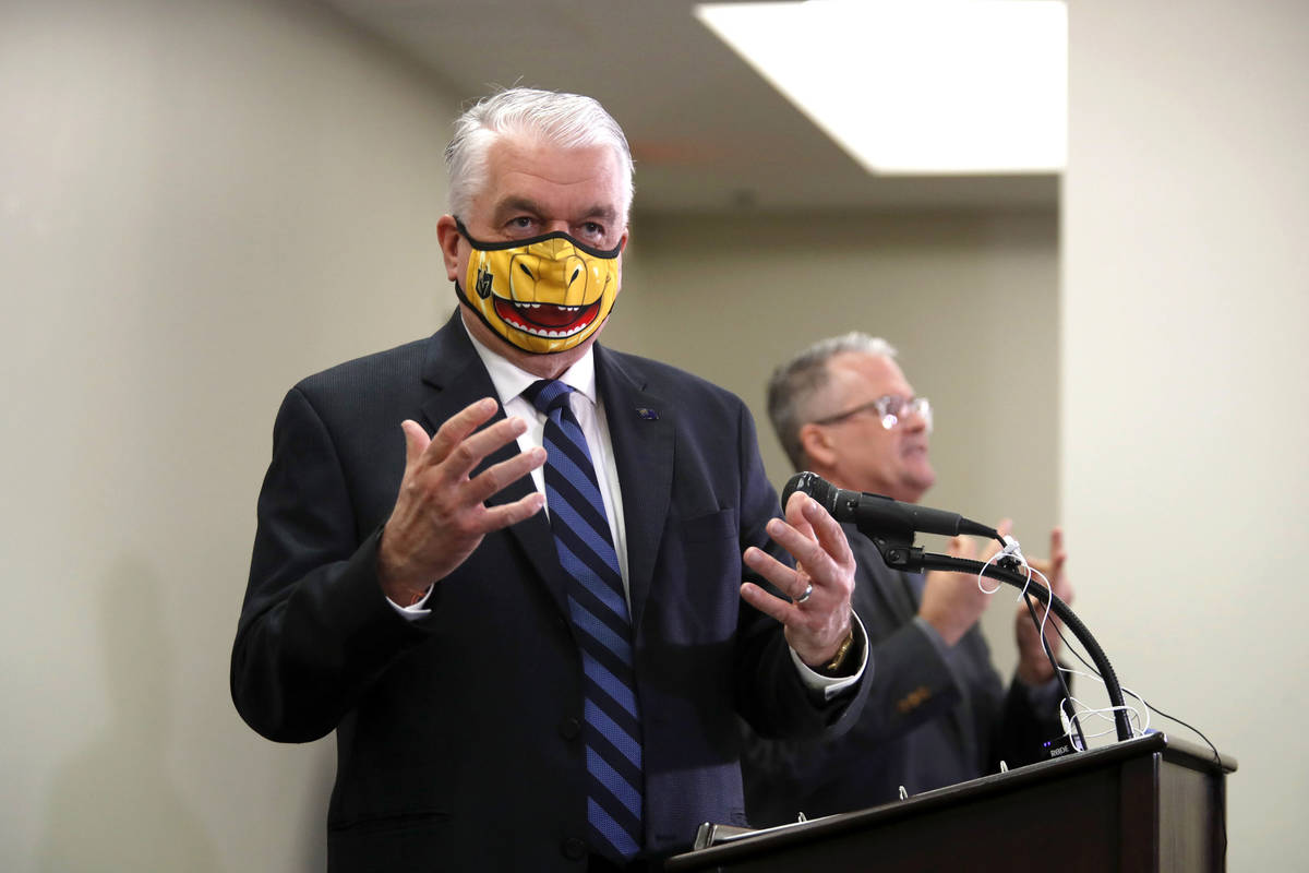 Nevada Governor Steve Sisolak responds to a question during a news conference at the Grant Sawy ...