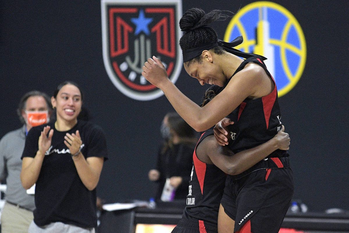Las Vegas Aces center A'ja Wilson, right, and guard Sugar Rodgers celebrate after getting the w ...