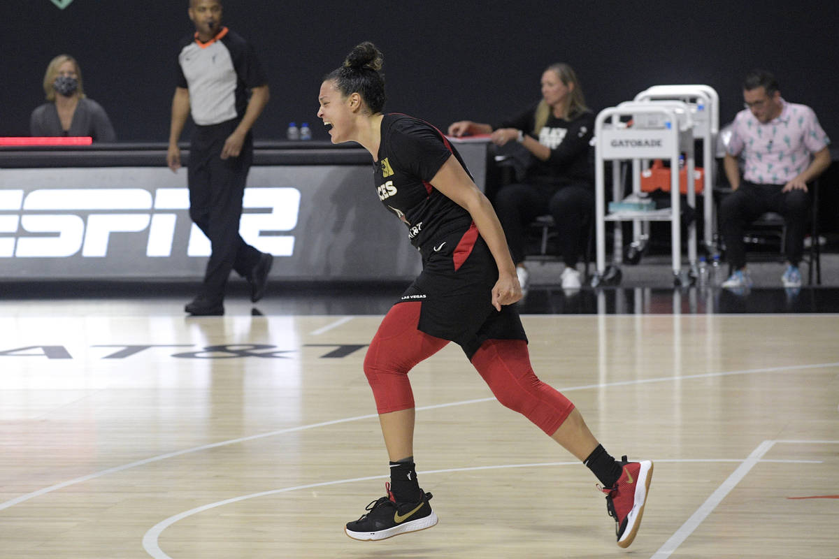 Las Vegas Aces guard Kayla McBride celebrates after getting the win over the Connecticut Sun in ...