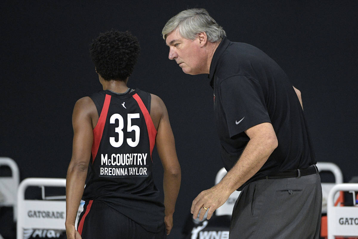 Las Vegas Aces head coach Bill Laimbeer, right, talks with forward Angel McCoughtry (35) during ...