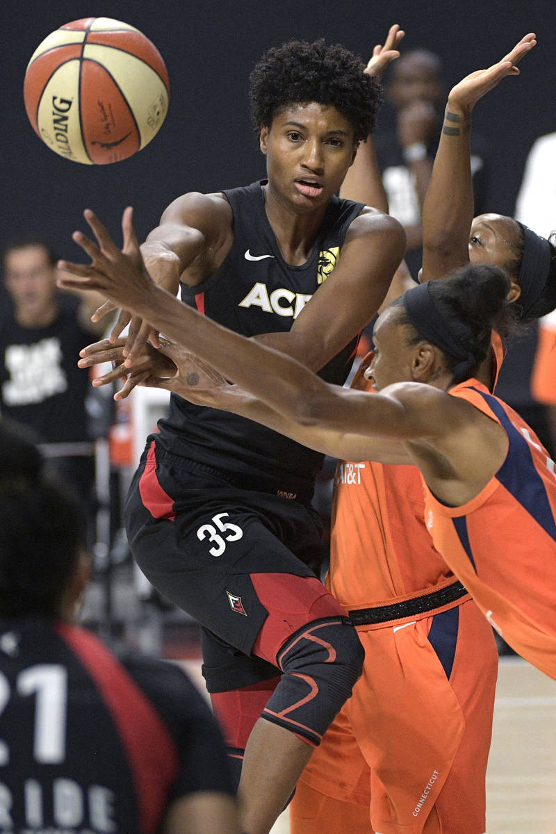 Las Vegas Aces forward Angel McCoughtry (35) passes the ball in front of Connecticut Sun guard ...
