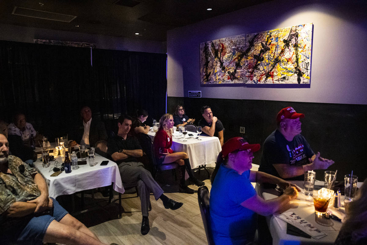 Supporters of President Donald Trump cheer during a debate watch party at Rhythm Kitchen in Las ...