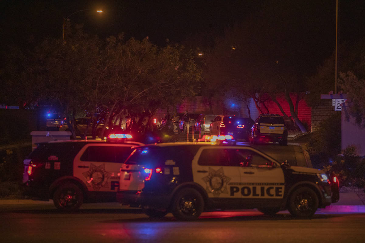 Las Vegas police are seen blocking West Erie Ave. and South Cochiti Lake St in Las Vegas, on Tu ...