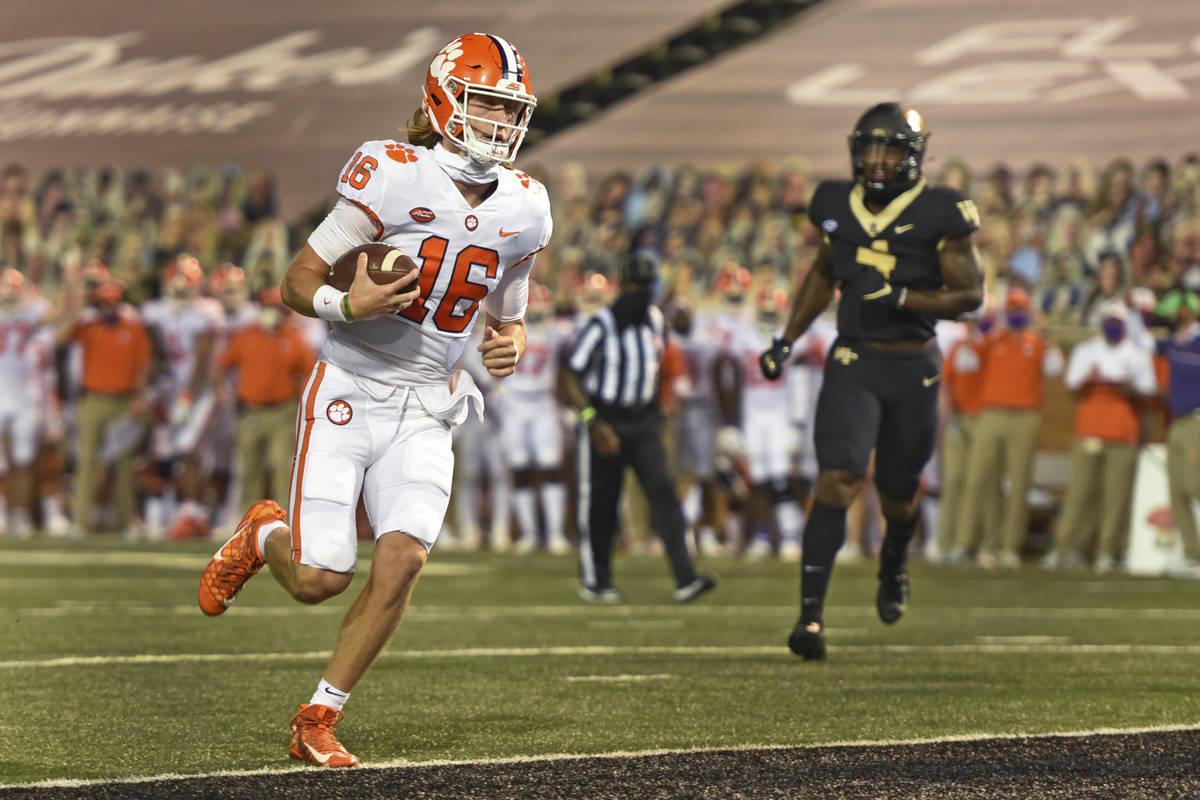 Clemson quarterback Trevor Lawrence scores against Wake Forest during the first half of an NCAA ...