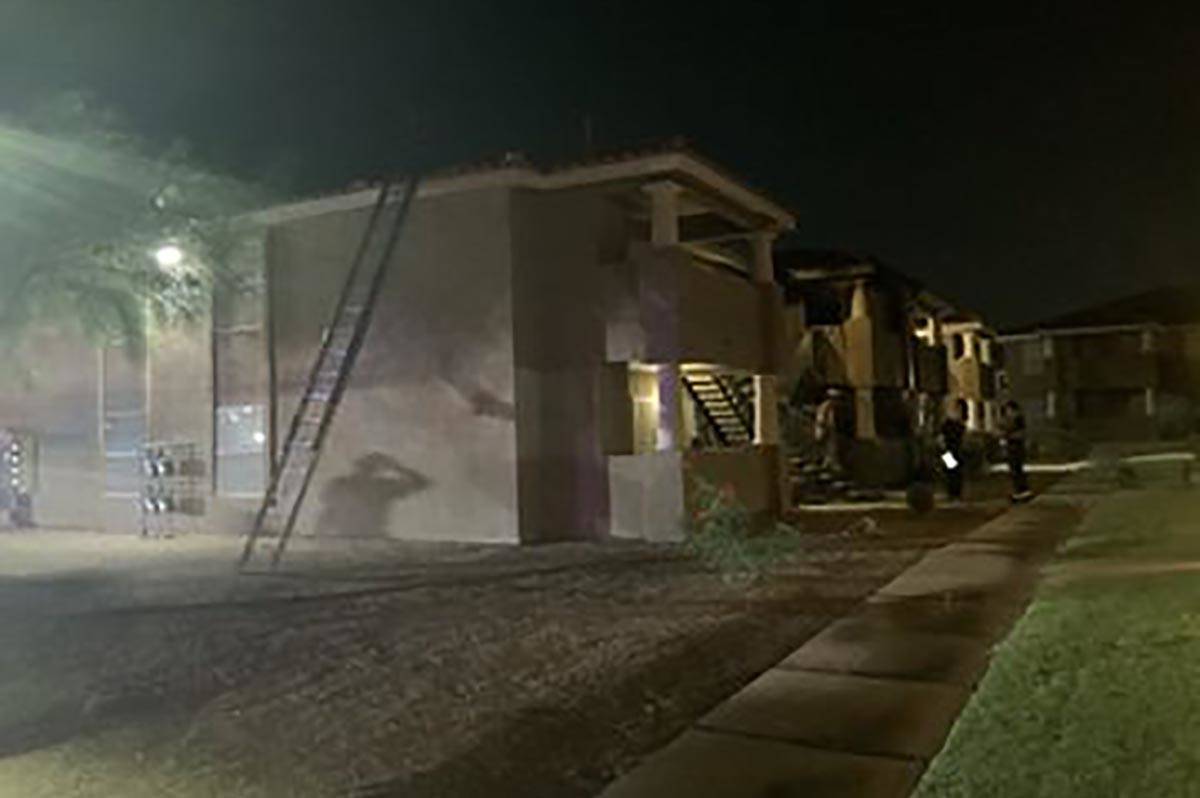 Two people were treated for smoke inhalation after a fire on a second-story balcony of an apart ...