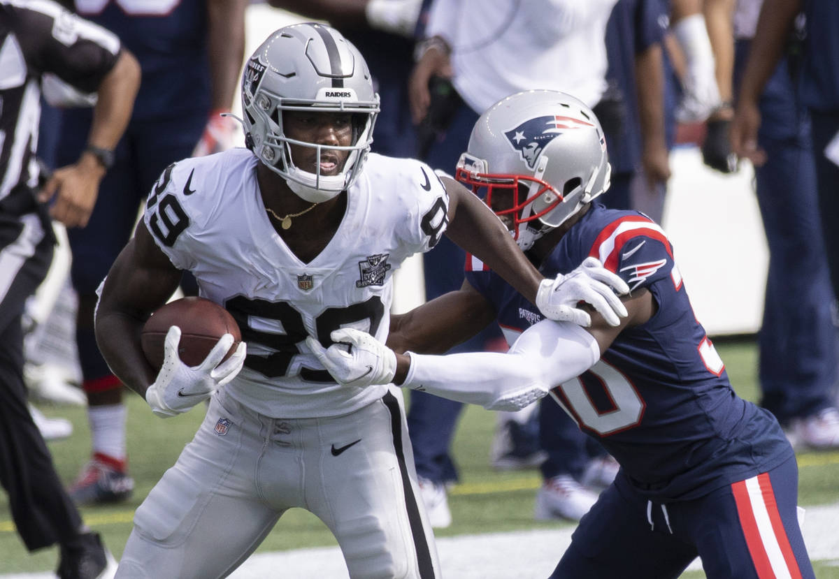 Las Vegas Raiders wide receiver Bryan Edwards (89) fights to break free from New England Patrio ...