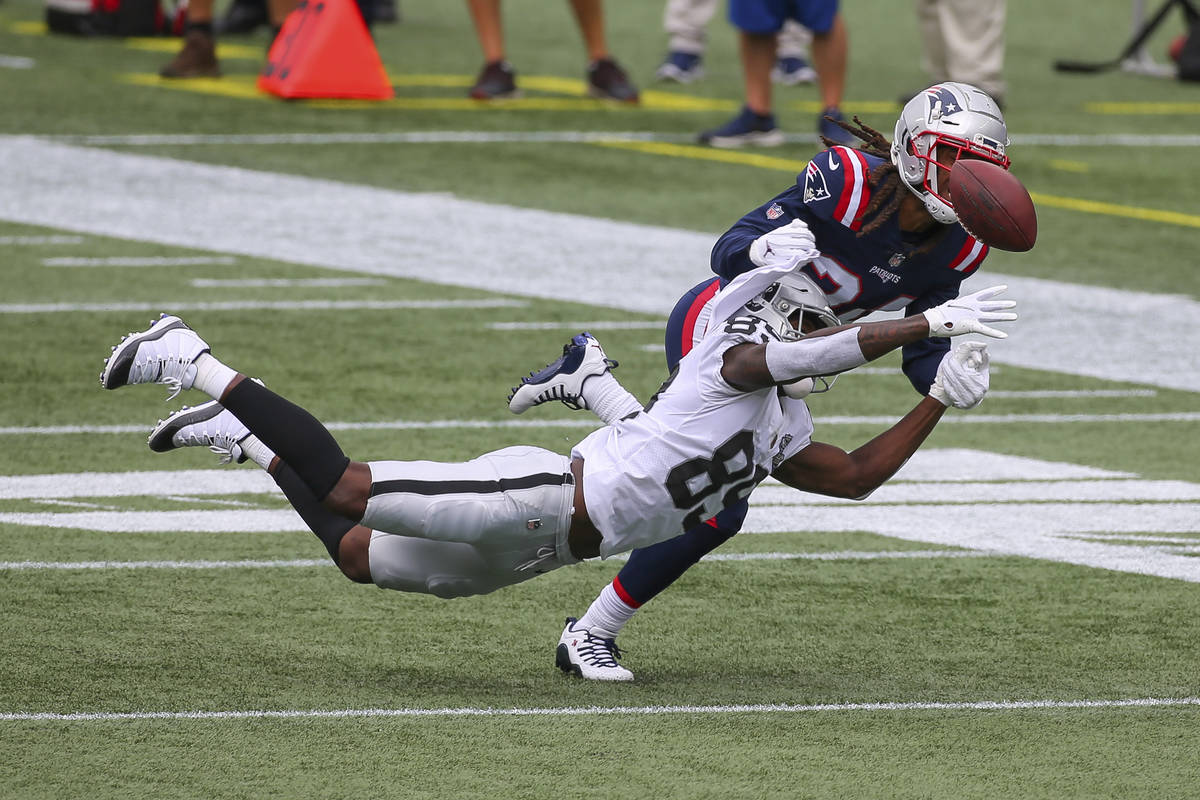 New England Patriots cornerback Stephon Gilmore (24) breaks up a pass intended for Las Vegas Ra ...