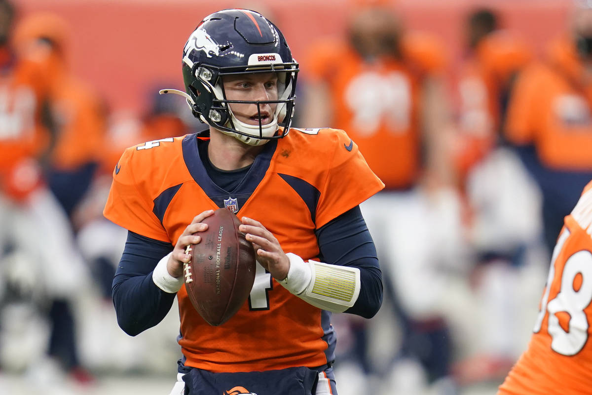 Denver Broncos quarterback Brett Rypien throws a pass during the second half of an NFL football ...