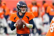 Denver Broncos quarterback Brett Rypien throws a pass during the second half of an NFL football ...