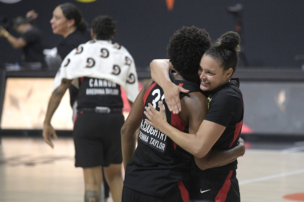 Las Vegas Aces forward Angel McCoughtry (35) and guard Kayla McBride, right, celebrate after Ga ...