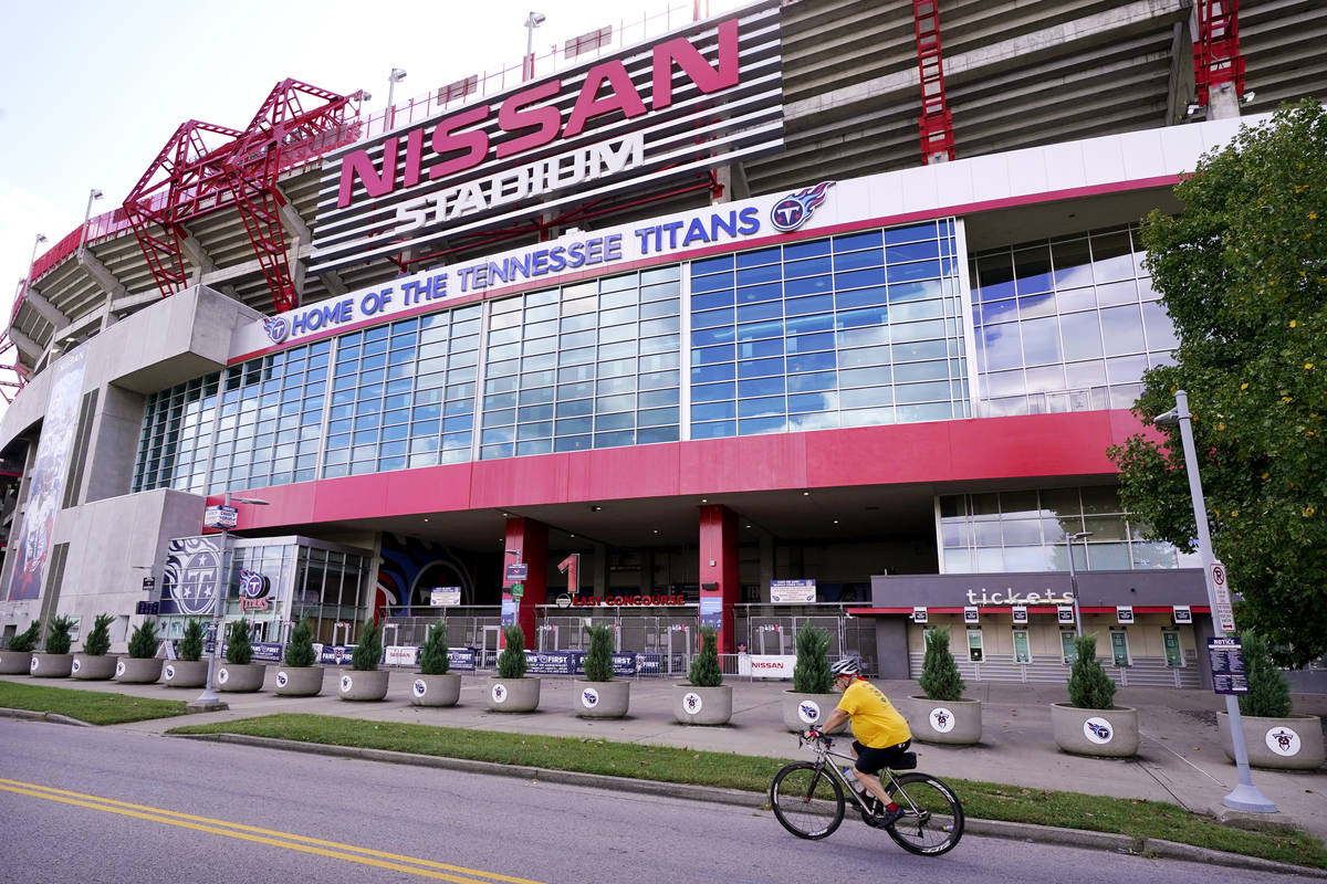 A cyclist passes by Nissan Stadium, home of the Tennessee Titans, Tuesday, Sept. 29, 2020, in N ...