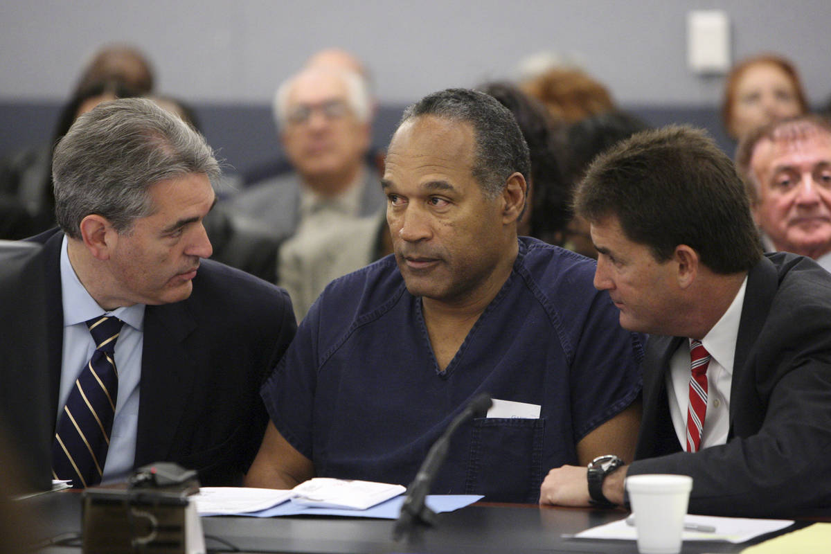 O.J. Simpson appears in court with attorneys Gabriel Grasso, left, and Yale Galanter prior to h ...