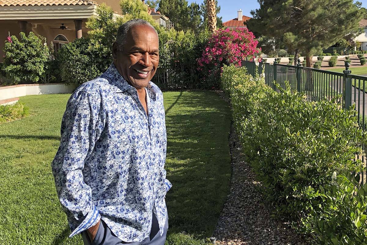 This photo provided by Didier J. Fabien shows O.J. Simpson in the garden of his Las Vegas area ...