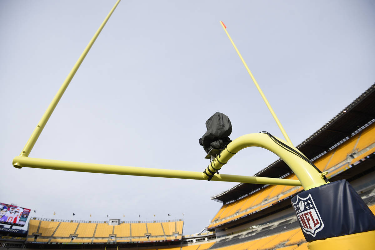 A television camera is mounted on the goal post at Heinz Field before an NFL football game betw ...