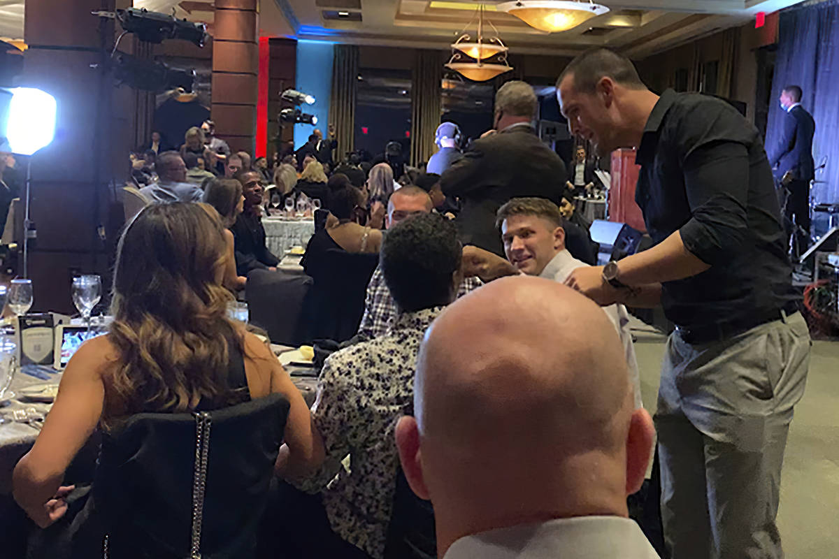 In this still image taken from video, Las Vegas Raiders quarterback Derek Carr, right, meets wi ...