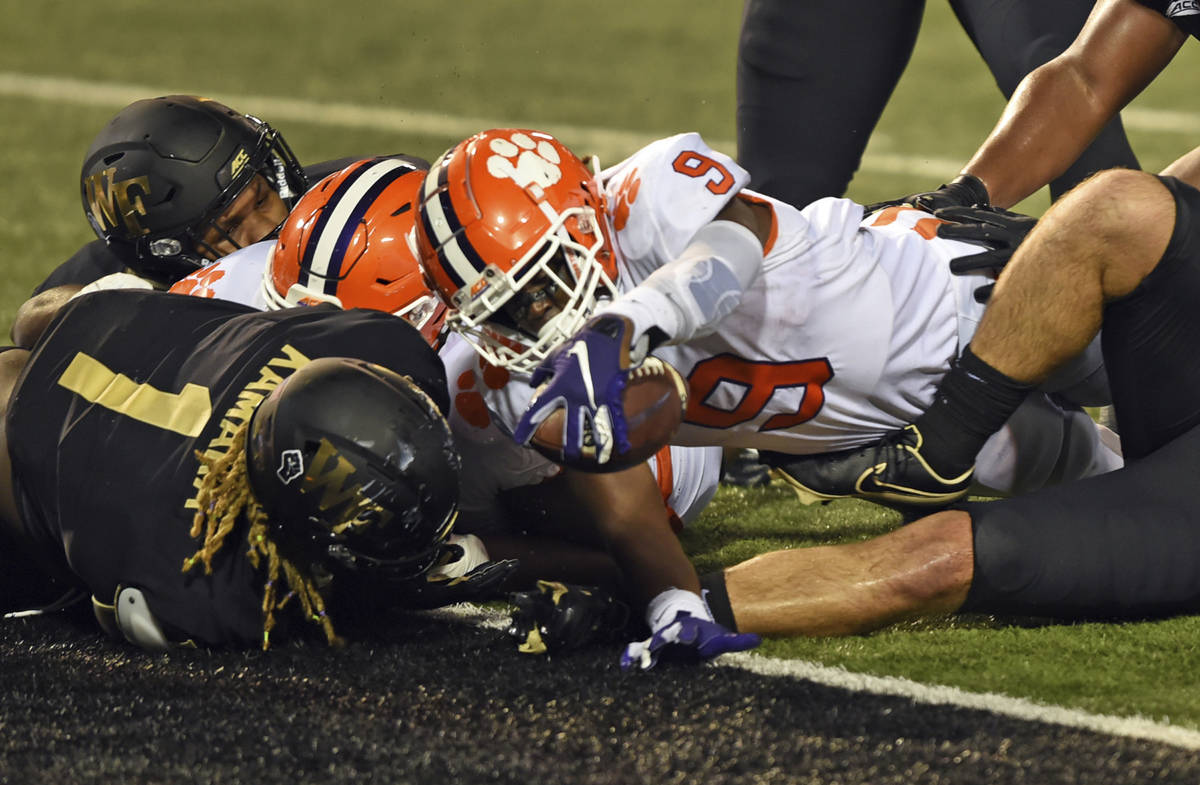 Clemson running back Travis Etienne reaches out to score against Wake Forest during the second ...