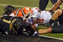 Clemson running back Travis Etienne reaches out to score against Wake Forest during the second ...