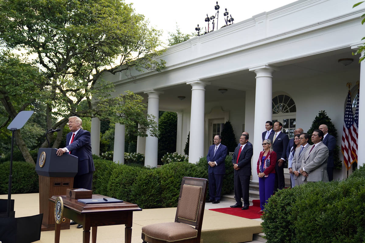 President Donald Trump speaks before signing an executive order on the "White House Hispan ...