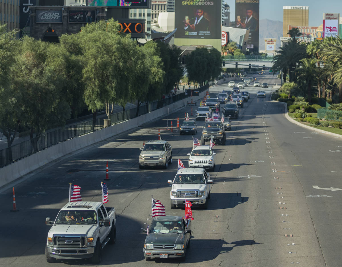 A caravan of Trump supporters ride down the Las Vegas Strip, on Wednesday, Sept. 30, 2020. (Eli ...