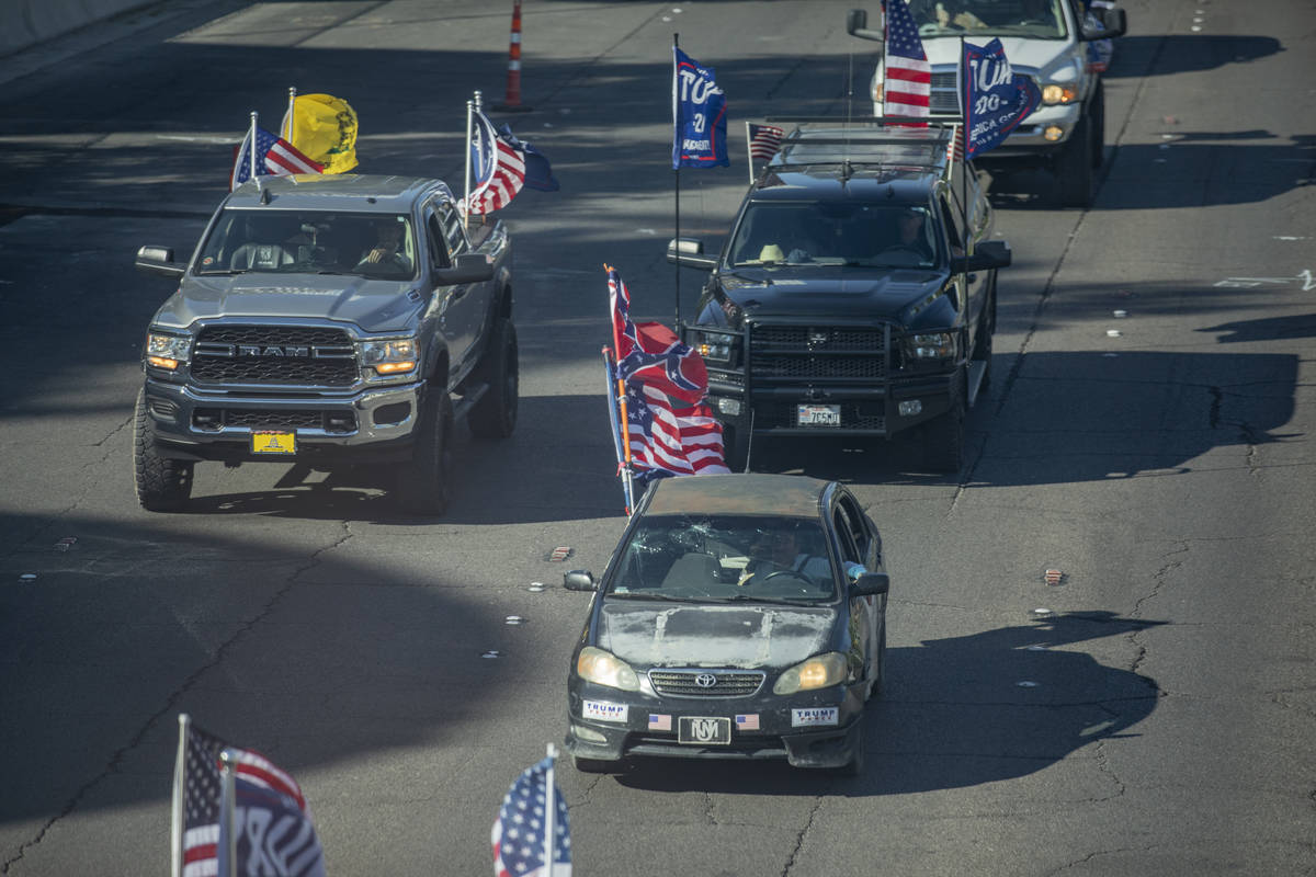 A caravan of Trump supporters ride down the Las Vegas Strip, on Wednesday, Sept. 30, 2020. (Eli ...