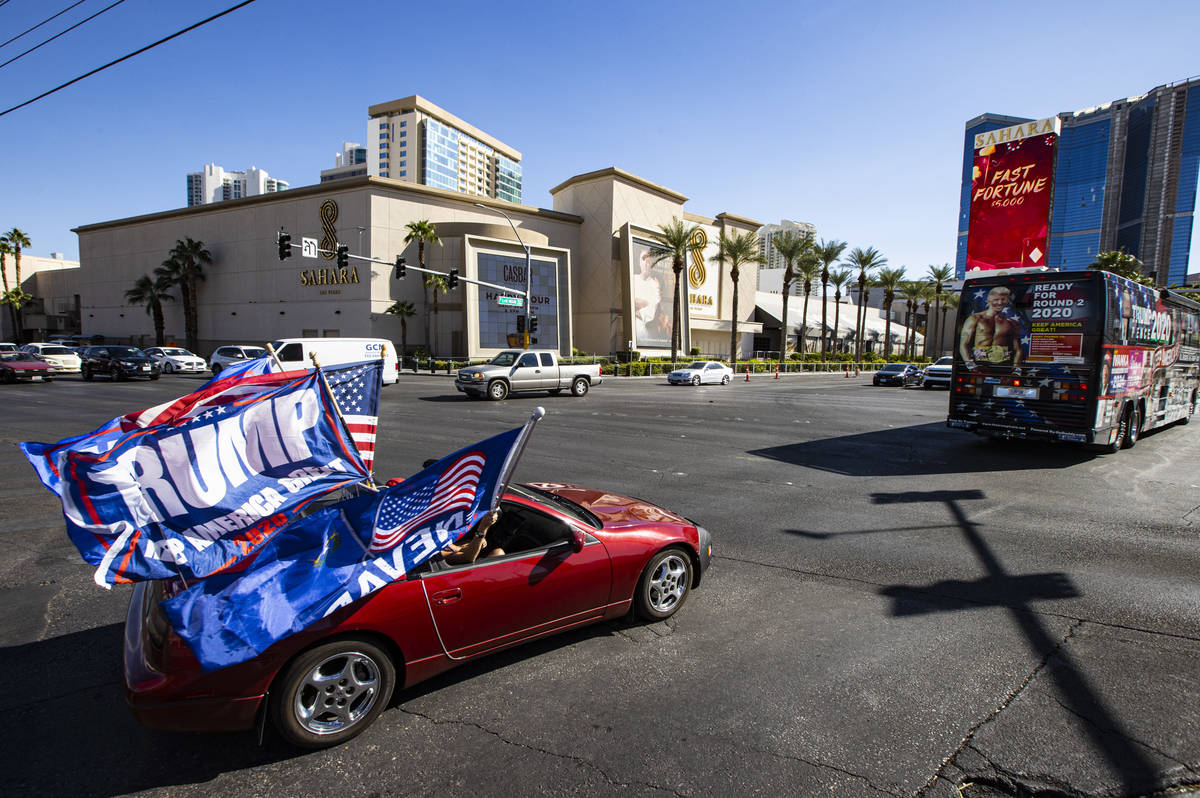 Helen McDonald, of Las Vegas, drives her car at the start of a parade in support of law enforce ...