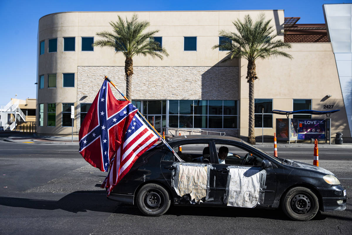 People participate in a parade in support of law enforcement and President Donald Trump in Las ...