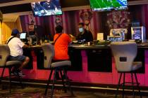 Chairs at a bar in the Flamingo Las Vegas are spaced out to maintain social distance on Monday, ...